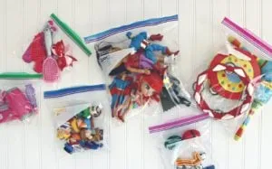 Toys sorted into clear zip-top bags so a child can see what is inside