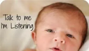 Close-up of a newborn baby’s face beside handwritten text reading “Talk to me, I’m listening”