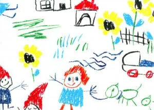 Child's crayon drawing of people, houses, flowers and a car