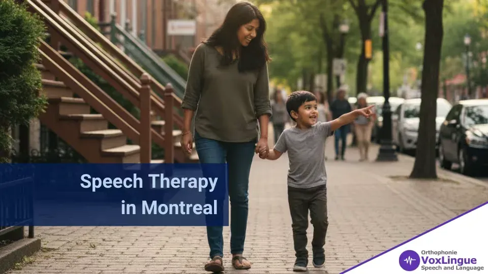 Mother and young son walking hand in hand along a city sidewalk, the boy pointing ahead excitedly
