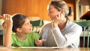 Girl telling her mother a story with animated gestures