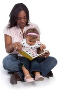 Mother reading a picture book with a toddler on her lap